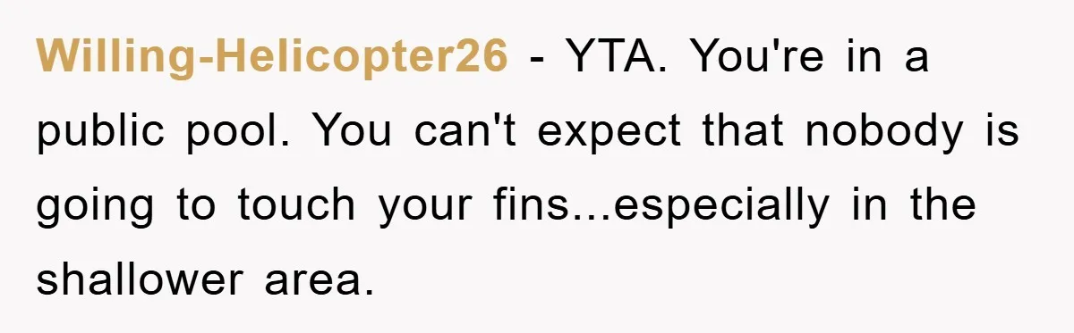 Willing-Helicopter26 − YTA. You're in a public pool. You can't expect that nobody is going to touch your fins...especially in the shallower area.