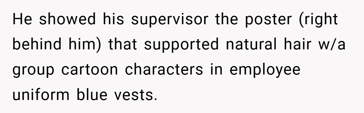 He showed his supervisor the poster (right behind him) that supported natural hair w/a group cartoon characters in employee uniform blue vests.