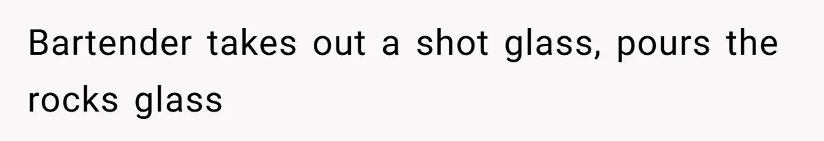 Bartender takes out a shot glass, pours the rocks glass