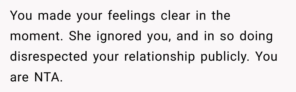 You made your feelings clear in the moment. She ignored you, and in so doing disrespected your relationship publicly. You are NTA.
