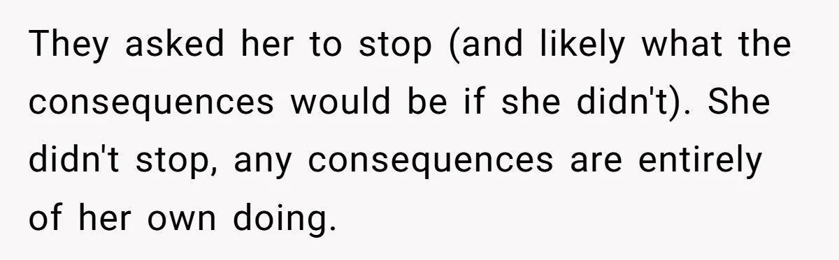 They asked her to stop (and likely what the consequences would be if she didn't). She didn't stop, any consequences are entirely of her own doing.