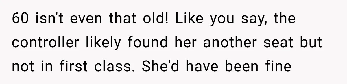 60 isn't even that old! Like you say, the controller likely found her another seat but not in first class. She'd have been fine