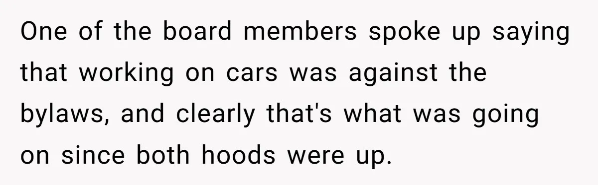 One of the board members spoke up saying that working on cars was against the bylaws, and clearly that's what was going on since both hoods were up.