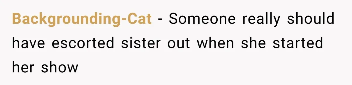 Backgrounding-Cat − Someone really should have escorted sister out when she started her show