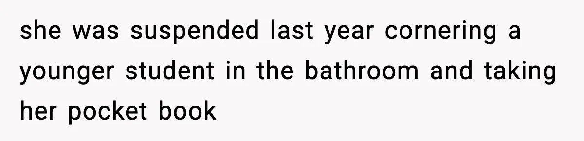 she was suspended last year cornering a younger student in the bathroom and taking her pocket book