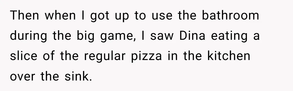 Then when I got up to use the bathroom during the big game, I saw Dina eating a slice of the regular pizza in the kitchen over the sink.