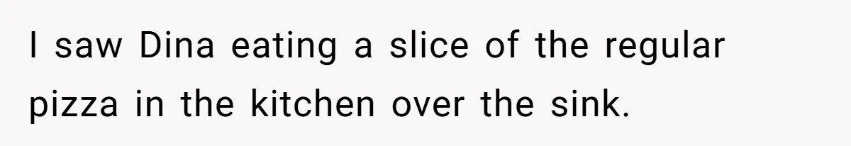 I saw Dina eating a slice of the regular pizza in the kitchen over the sink.