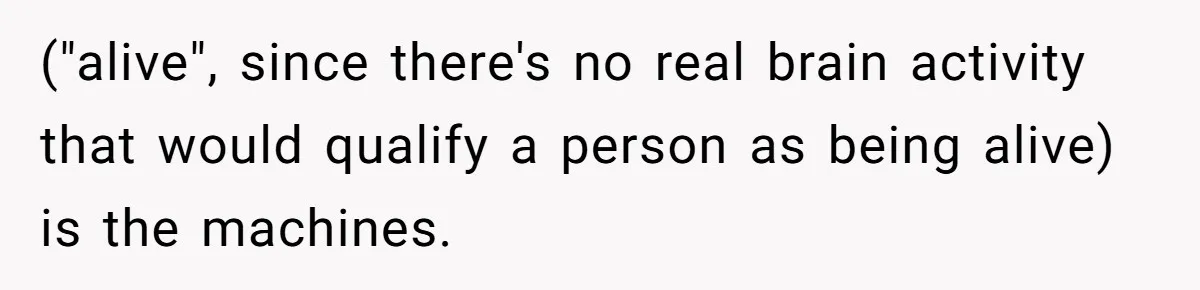 ("alive", since there's no real brain activity that would qualify a person as being alive) is the machines.