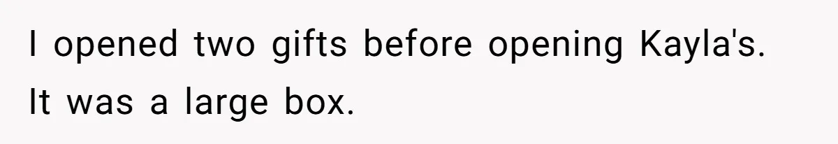 I opened two gifts before opening Kayla's. It was a large box.