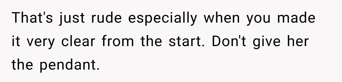 That's just rude especially when you made it very clear from the start. Don't give her the pendant.