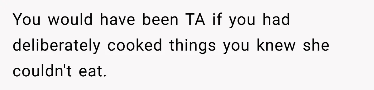 You would have been TA if you had deliberately cooked things you knew she couldn't eat.