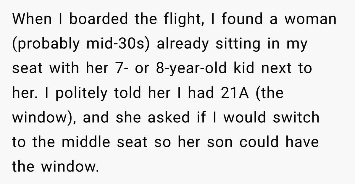 When I boarded the flight, I found a woman (probably mid-30s) already sitting in my seat with her 7- or 8-year-old kid next to her. I politely told her I...