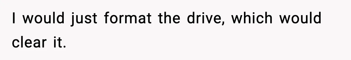 I would just format the drive, which would clear it.