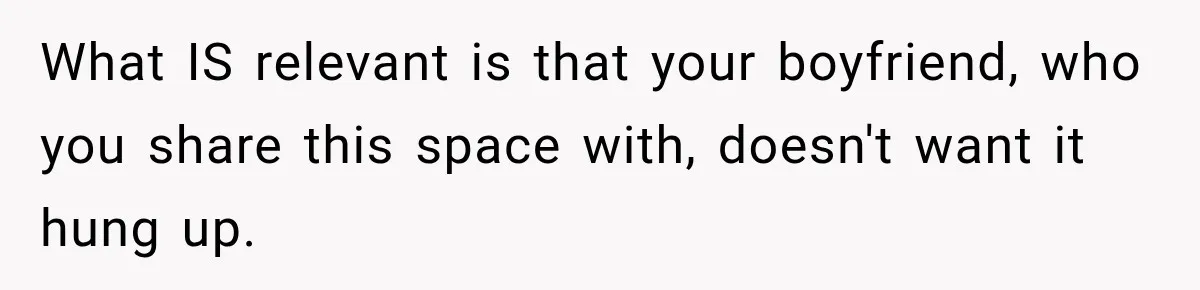 What IS relevant is that your boyfriend, who you share this space with, doesn't want it hung up.