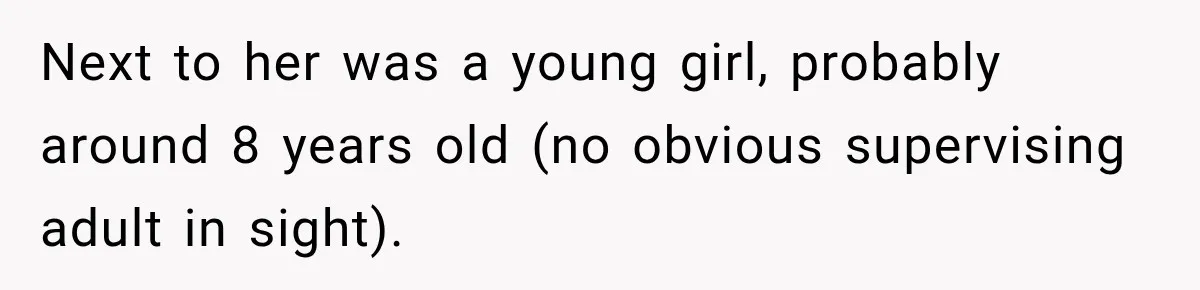 Next to her was a young girl, probably around 8 years old (no obvious supervising adult in sight).