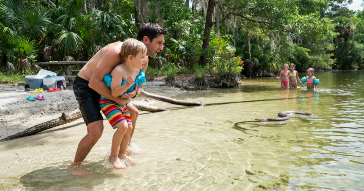 Dad Saves His Son From A Snake, Then Accidentally Sends It Flying Onto A Girl Scout Picnic Table